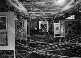 John D. Schiff (American, born Germany, 1907-1976). Gallery view of First Papers of Surrealism with Marcel Duchamp's installation known as Sixteen Miles of String, 1942. --- Philadelphia Museum of Art, Archives, Alexina and Marcel Duchamp Papers. Gift of Jacqueline, Paul, and Peter Matisse in memory of their mother, Alexina Duchamp