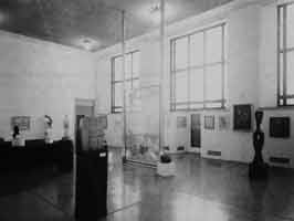View of The Large Glass installed in the Arensberg Collection, Gallery 1729, at the Philadelphia Museum of Art, 1965; center right, the door to the balcony overlooking the East Terrace