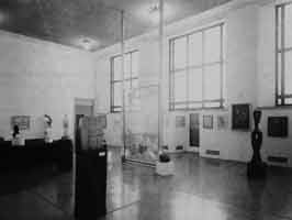 View of The Large Glass installed in the Arensberg Collection ... View of The Large Glass installed in the Arensberg Collection, Gallery 1729, at the Philadelphia Museum of Art, 1965; center right, the door to the balcony overlooking the East Terrace