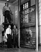 Duchamp installing The Large Glass at the Philadelphia Museum of Art, 1954.