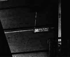 Anonymous undated photograph of an apartment building in Paris, with an Eau & gaz plaque, c. 1959.