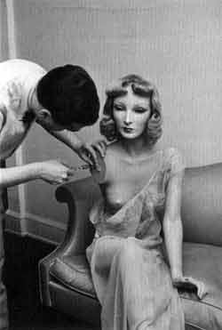 Alfred Eisenstaedt (American, 1898-1995). Cynthia and Lester Gaba, published in Life, December 1937. Gaba repairs the mannequin's arm.