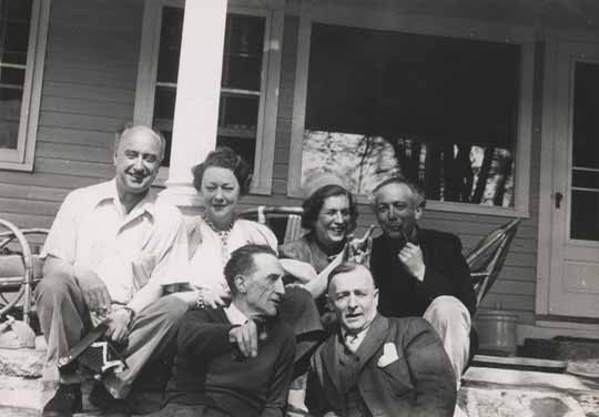 Yves Tanguy, Kay Sage, Maria Martins, Enrico Donati (back row), Marcel Duchamp and Frederick Kiesler (front row) in front of Kay Sage’s house in Woodbury, Connecticut, circa 1946-47.